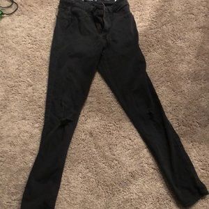 Used faded black ripped jeans